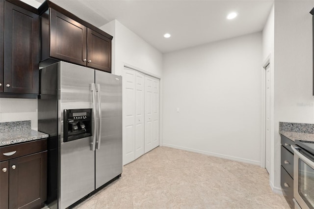 1218 Vienna Square Dr, Winter Haven, FL 33884 - kitchen featuring appliances with stainless steel finishes, dark brown cabinets, light stone countertops, recessed lighting, and light tile patterned floors