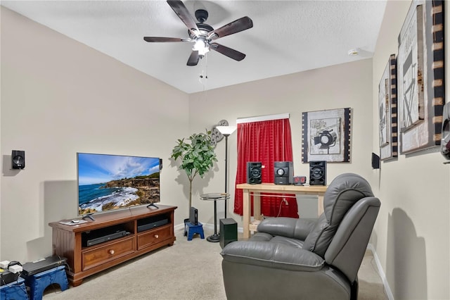 1414 Marsh Meadow Ln, Davenport, FL 33896 - living area featuring a ceiling fan, light colored carpet, and a textured ceiling