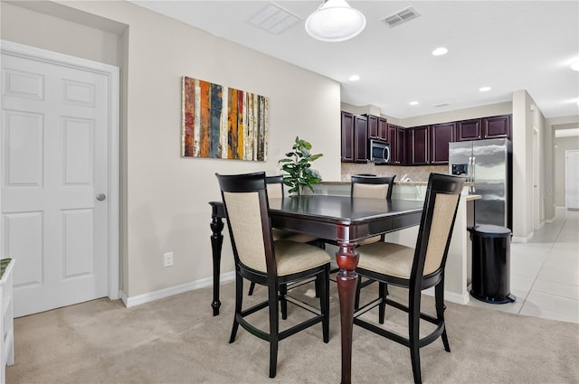 1414 Marsh Meadow Ln, Davenport, FL 33896 - dining room with light carpet and recessed lighting