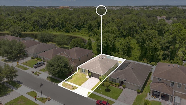 1414 Marsh Meadow Ln, Davenport, FL 33896 - aerial perspective of suburban area with a heavily wooded area and property parcel outlined