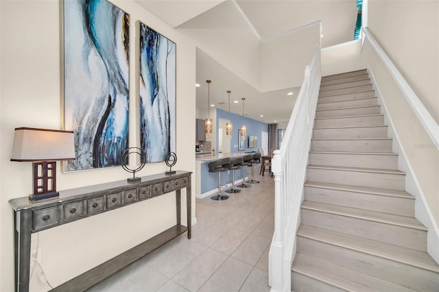 8940 Zurich Ln, Kissimmee, FL 34747 - staircase with tile patterned floors and recessed lighting