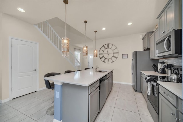 8940 Zurich Ln, Kissimmee, FL 34747 - kitchen featuring stainless steel appliances, gray cabinetry, light countertops, and recessed lighting
