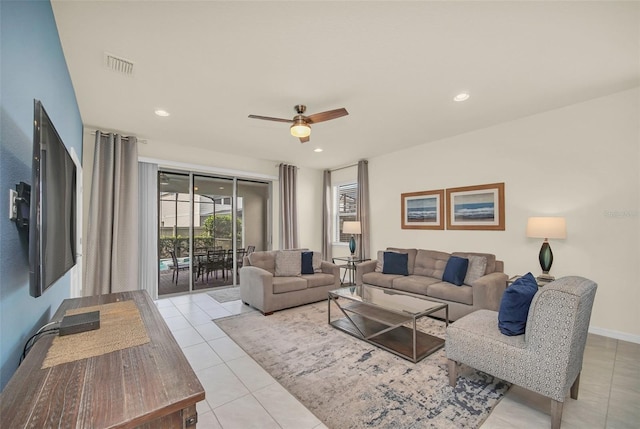 8940 Zurich Ln, Kissimmee, FL 34747 - living area with light tile patterned floors, a ceiling fan, and recessed lighting