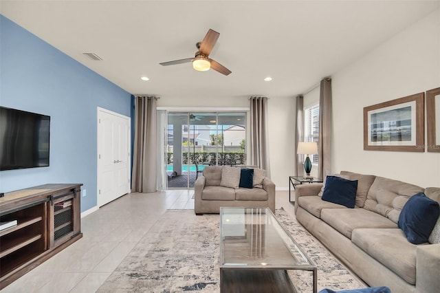 8940 Zurich Ln, Kissimmee, FL 34747 - living room featuring ceiling fan, light tile patterned floors, and recessed lighting