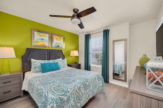 8940 Zurich Ln, Kissimmee, FL 34747 - bedroom featuring wood finished floors and a ceiling fan