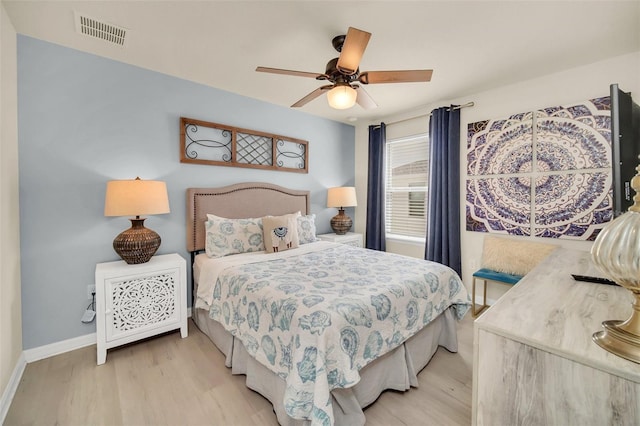 8940 Zurich Ln, Kissimmee, FL 34747 - bedroom with light wood-style floors and ceiling fan