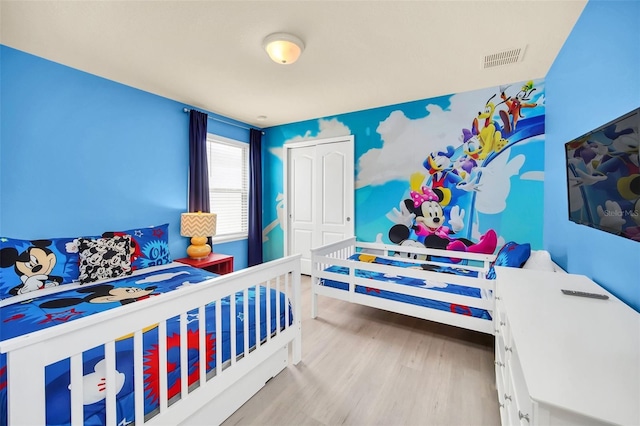 8940 Zurich Ln, Kissimmee, FL 34747 - bedroom with wood finished floors and a closet
