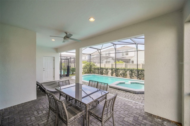 8940 Zurich Ln, Kissimmee, FL 34747 - view of pool featuring a patio area, a pool with connected hot tub, ceiling fan, and a lanai
