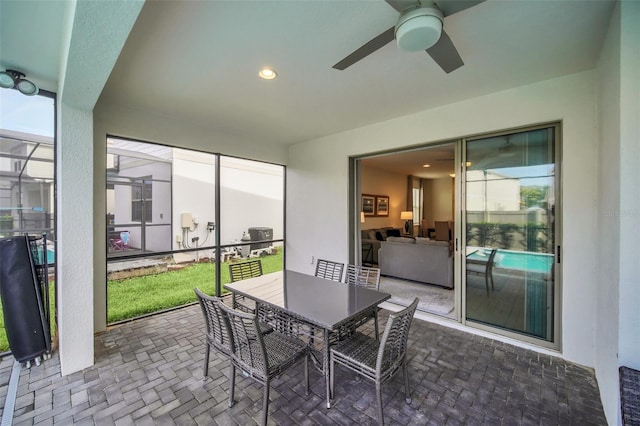 8940 Zurich Ln, Kissimmee, FL 34747 - sunroom / solarium featuring ceiling fan and outdoor dining area