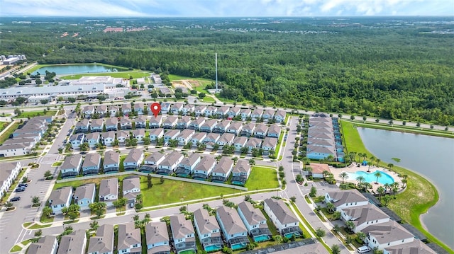 8940 Zurich Ln, Kissimmee, FL 34747 - aerial view of property and surrounding area featuring a forest and nearby suburban area