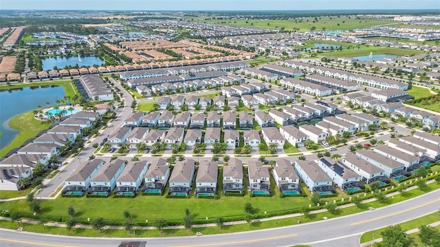 8940 Zurich Ln, Kissimmee, FL 34747 - aerial view of property and surrounding area with a large body of water and nearby suburban area