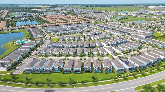 8940 Zurich Ln, Kissimmee, FL 34747 - aerial view of property and surrounding area featuring a nearby body of water and nearby suburban area