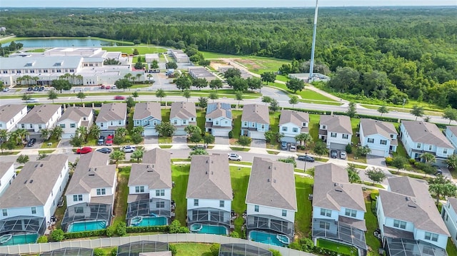 8940 Zurich Ln, Kissimmee, FL 34747 - aerial perspective of suburban area with a heavily wooded area and a large body of water