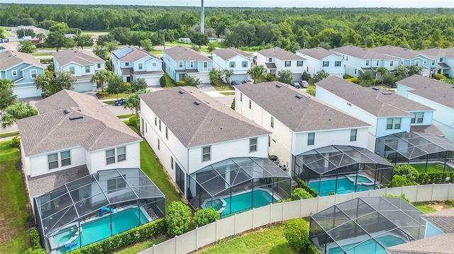 8940 Zurich Ln, Kissimmee, FL 34747 - aerial perspective of suburban area featuring a pool area and a forest