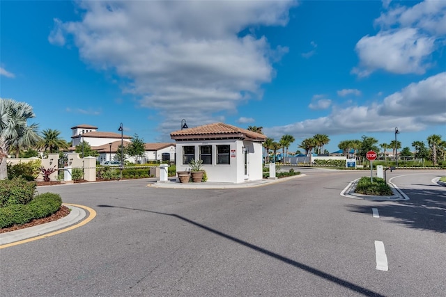 8940 Zurich Ln, Kissimmee, FL 34747 - view of asphalt street with street lighting, traffic signs, and curbs