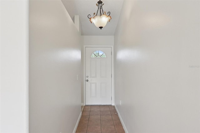 1742 Van Allen Cir, Deltona, FL 32738 - doorway with light tile patterned flooring and baseboards