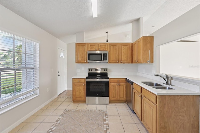 1742 Van Allen Cir, Deltona, FL 32738 - kitchen with appliances with stainless steel finishes, light tile patterned flooring, lofted ceiling, a textured ceiling, and light countertops