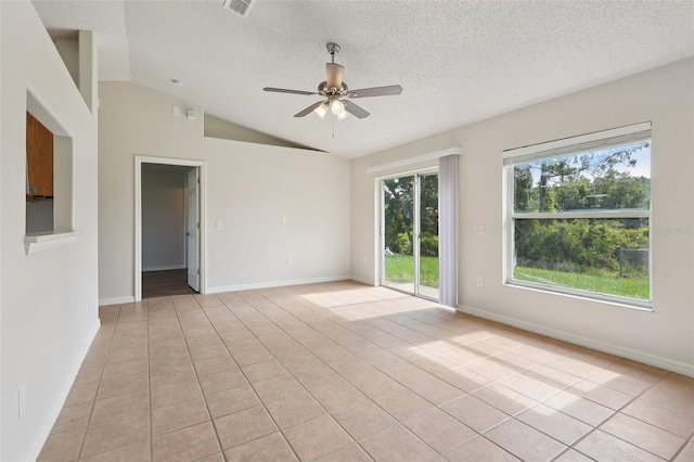 1742 Van Allen Cir, Deltona, FL 32738 - empty room featuring ceiling fan, a textured ceiling, lofted ceiling, and light tile patterned floors