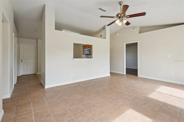 1742 Van Allen Cir, Deltona, FL 32738 - spare room with light tile patterned floors, lofted ceiling, and a ceiling fan