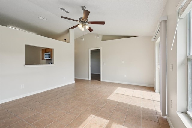 1742 Van Allen Cir, Deltona, FL 32738 - unfurnished room with ceiling fan, light tile patterned flooring, vaulted ceiling, and healthy amount of natural light