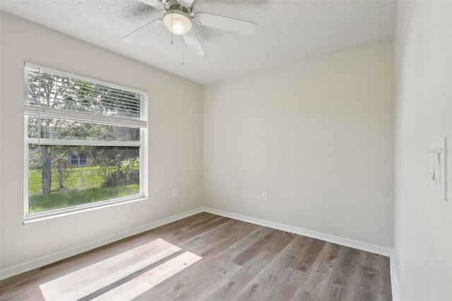 1742 Van Allen Cir, Deltona, FL 32738 - spare room with plenty of natural light, wood finished floors, a textured ceiling, and a ceiling fan