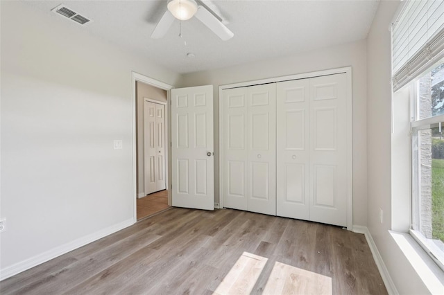1742 Van Allen Cir, Deltona, FL 32738 - unfurnished bedroom featuring wood finished floors, a closet, and a ceiling fan