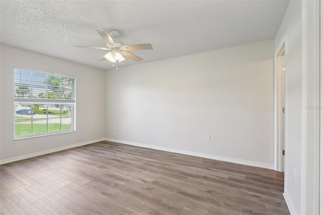 1742 Van Allen Cir, Deltona, FL 32738 - unfurnished room featuring a ceiling fan, wood finished floors, and a textured ceiling