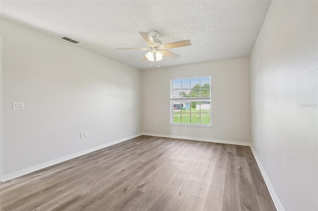1742 Van Allen Cir, Deltona, FL 32738 - unfurnished room featuring wood finished floors, ceiling fan, and a textured ceiling