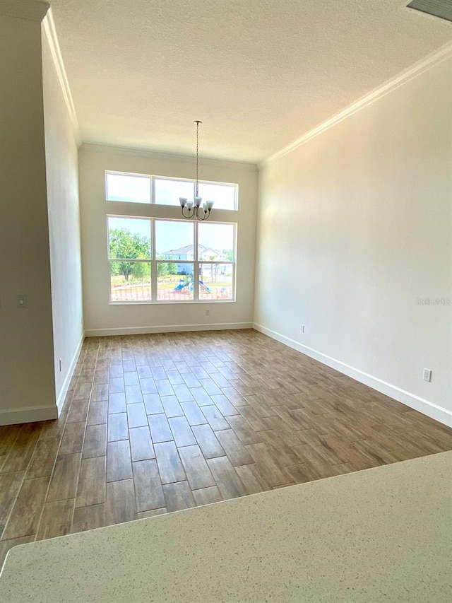 16071 Barkly Ridge Ct, Winter Garden, FL 34787 - spare room with ornamental molding, a chandelier, and wood finished floors