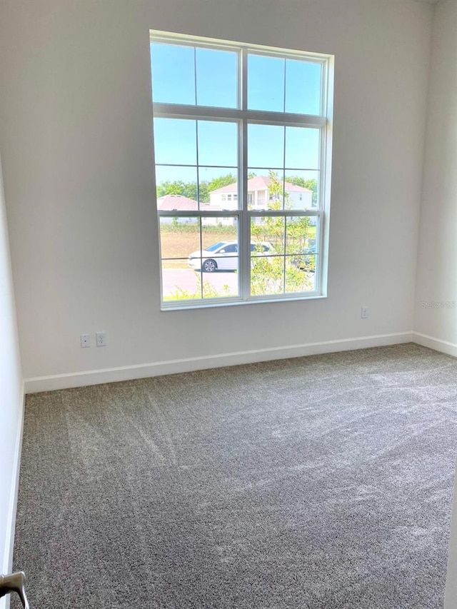 16071 Barkly Ridge Ct, Winter Garden, FL 34787 - carpeted empty room featuring baseboards