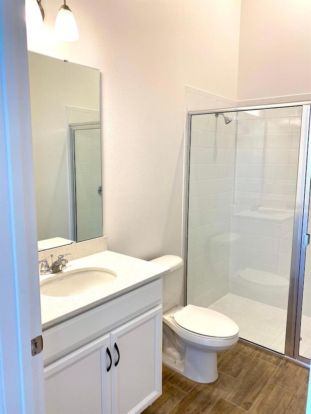 16071 Barkly Ridge Ct, Winter Garden, FL 34787 - bathroom featuring wood finished floors, vanity, and a stall shower