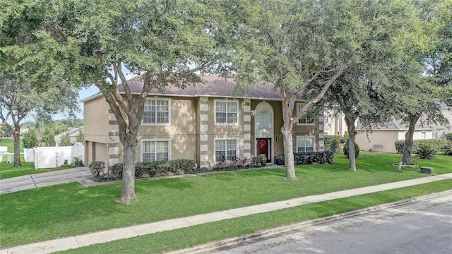 569 Yearling Cove Loop, Apopka, FL 32703 - view of front facade with driveway, a garage, stucco siding, and roof with shingles