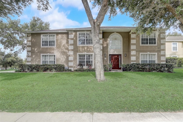 569 Yearling Cove Loop, Apopka, FL 32703 - view of front of property with a front lawn and stucco siding