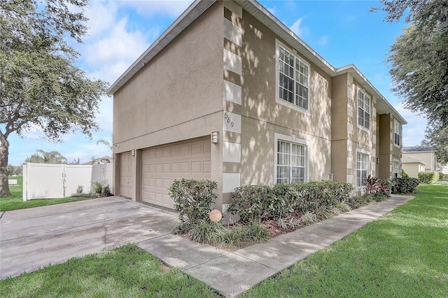 569 Yearling Cove Loop, Apopka, FL 32703 - view of property exterior featuring concrete driveway and stucco siding