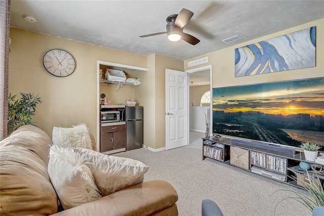 569 Yearling Cove Loop, Apopka, FL 32703 - carpeted living room featuring ceiling fan and baseboards