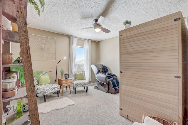 569 Yearling Cove Loop, Apopka, FL 32703 - living area featuring carpet floors, a ceiling fan, and a textured ceiling