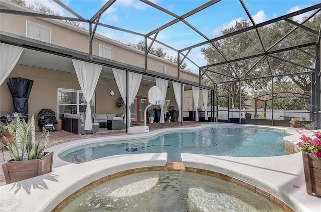 569 Yearling Cove Loop, Apopka, FL 32703 - view of pool featuring outdoor lounge area, a pool with connected hot tub, a patio, and a lanai
