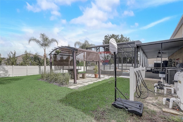 569 Yearling Cove Loop, Apopka, FL 32703 - fenced backyard with ceiling fan and a patio area