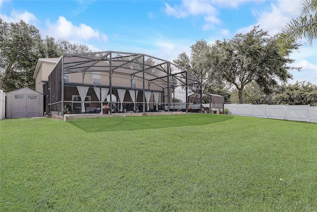 569 Yearling Cove Loop, Apopka, FL 32703 - back of property featuring a storage unit, a fenced backyard, and a lanai