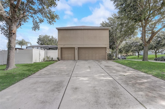 569 Yearling Cove Loop, Apopka, FL 32703 - view of home's exterior featuring an attached garage, driveway, and stucco siding