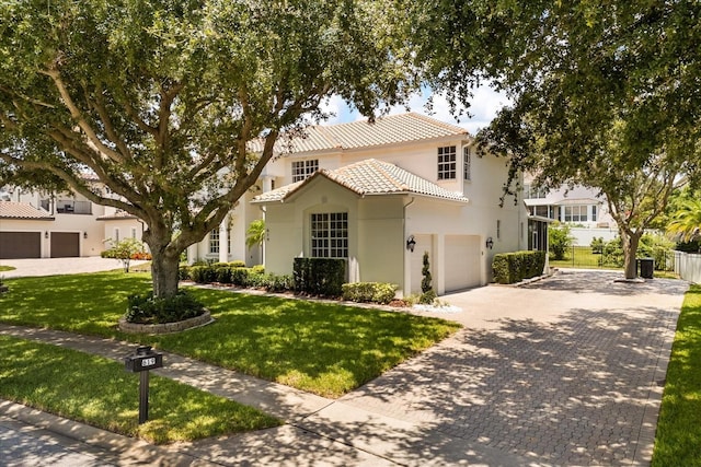 619 Largovista Dr, Oakland, FL 34787 - mediterranean / spanish-style house featuring decorative driveway, a tiled roof, stucco siding, and an attached garage