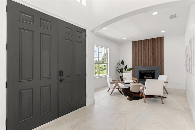 619 Largovista Dr, Oakland, FL 34787 - entrance foyer with arched walkways, recessed lighting, and a fireplace