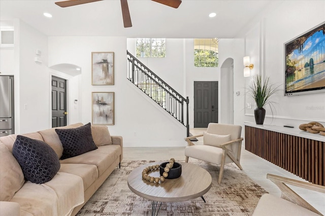 619 Largovista Dr, Oakland, FL 34787 - living room featuring arched walkways, a ceiling fan, stairway, and recessed lighting