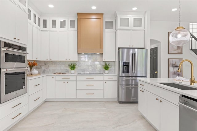 619 Largovista Dr, Oakland, FL 34787 - kitchen featuring appliances with stainless steel finishes, light countertops, decorative backsplash, recessed lighting, and white cabinetry