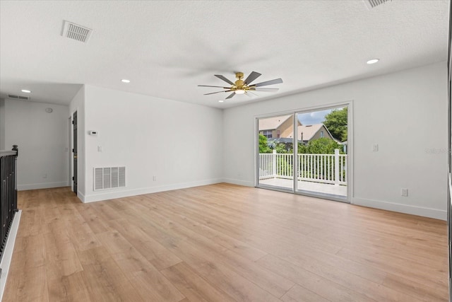 619 Largovista Dr, Oakland, FL 34787 - unfurnished living room featuring ceiling fan, light wood finished floors, recessed lighting, and a textured ceiling