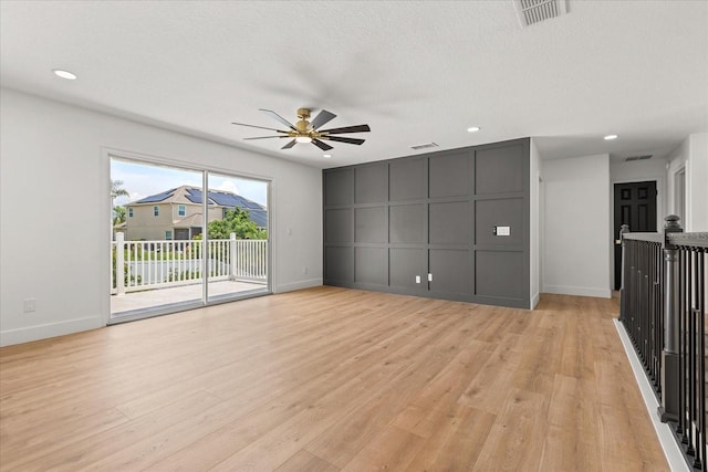 619 Largovista Dr, Oakland, FL 34787 - unfurnished living room with ceiling fan, recessed lighting, light wood-style flooring, and a decorative wall