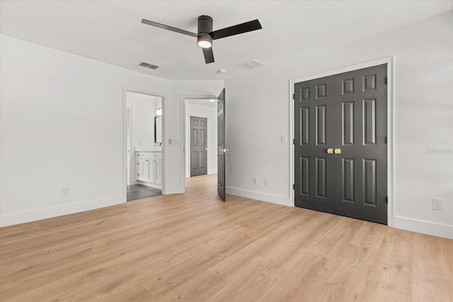 619 Largovista Dr, Oakland, FL 34787 - unfurnished bedroom featuring light wood finished floors, a closet, connected bathroom, and ceiling fan