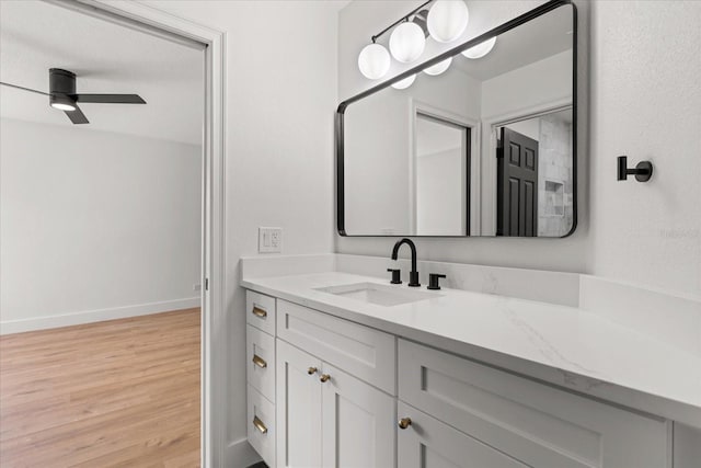 619 Largovista Dr, Oakland, FL 34787 - bathroom featuring wood finished floors, vanity, and ceiling fan