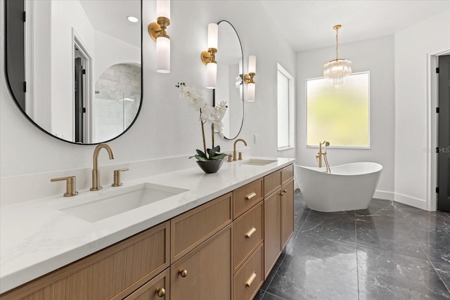 619 Largovista Dr, Oakland, FL 34787 - full bathroom with double vanity, a freestanding bath, marble tiled flooring, and a chandelier