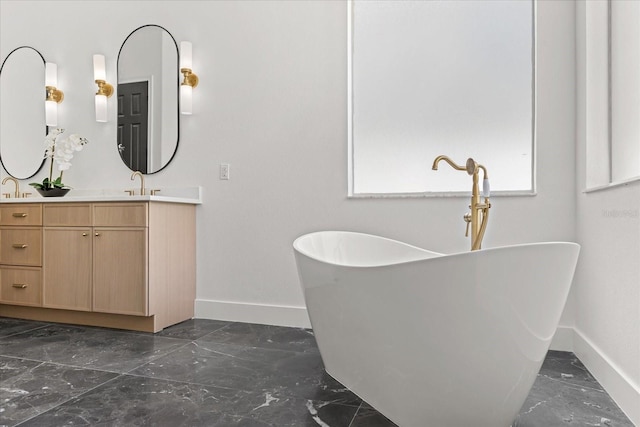 619 Largovista Dr, Oakland, FL 34787 - full bath with marble tiled floors, vanity, and a freestanding bath
